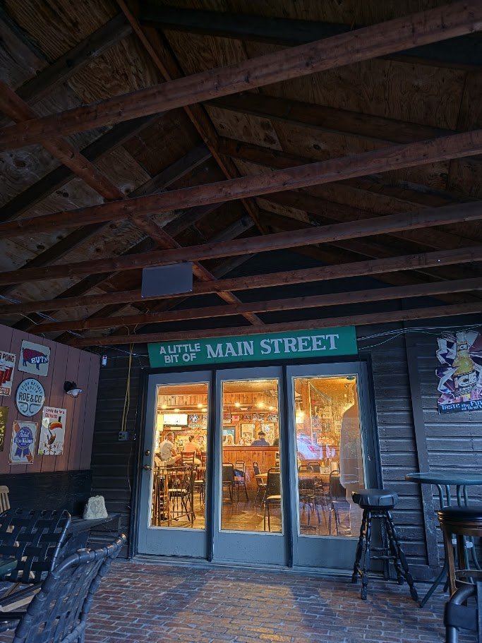Cozy tavern seating with wood accents.