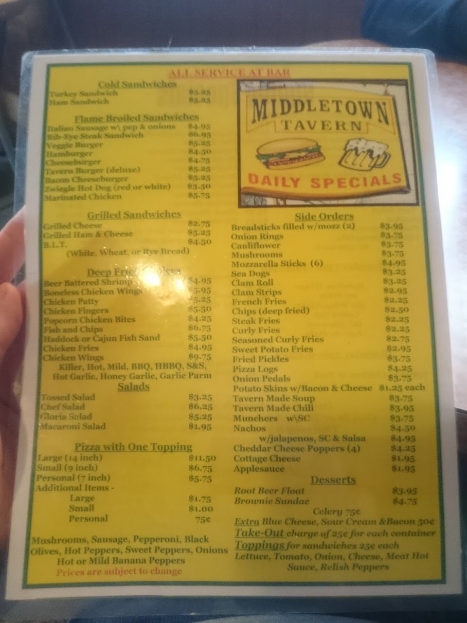Printed menu with sandwiches and daily specials.