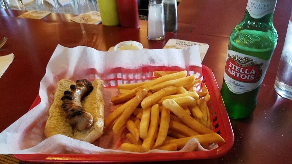 Printed menu with sandwiches and daily specials.