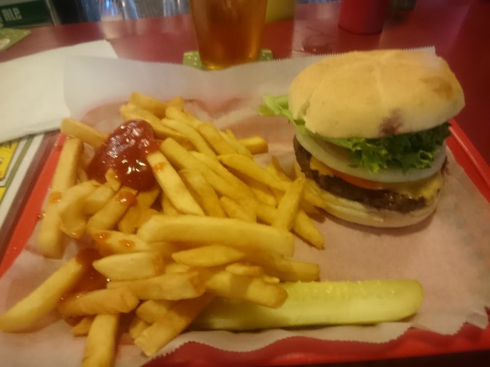 Printed menu with sandwiches and daily specials.